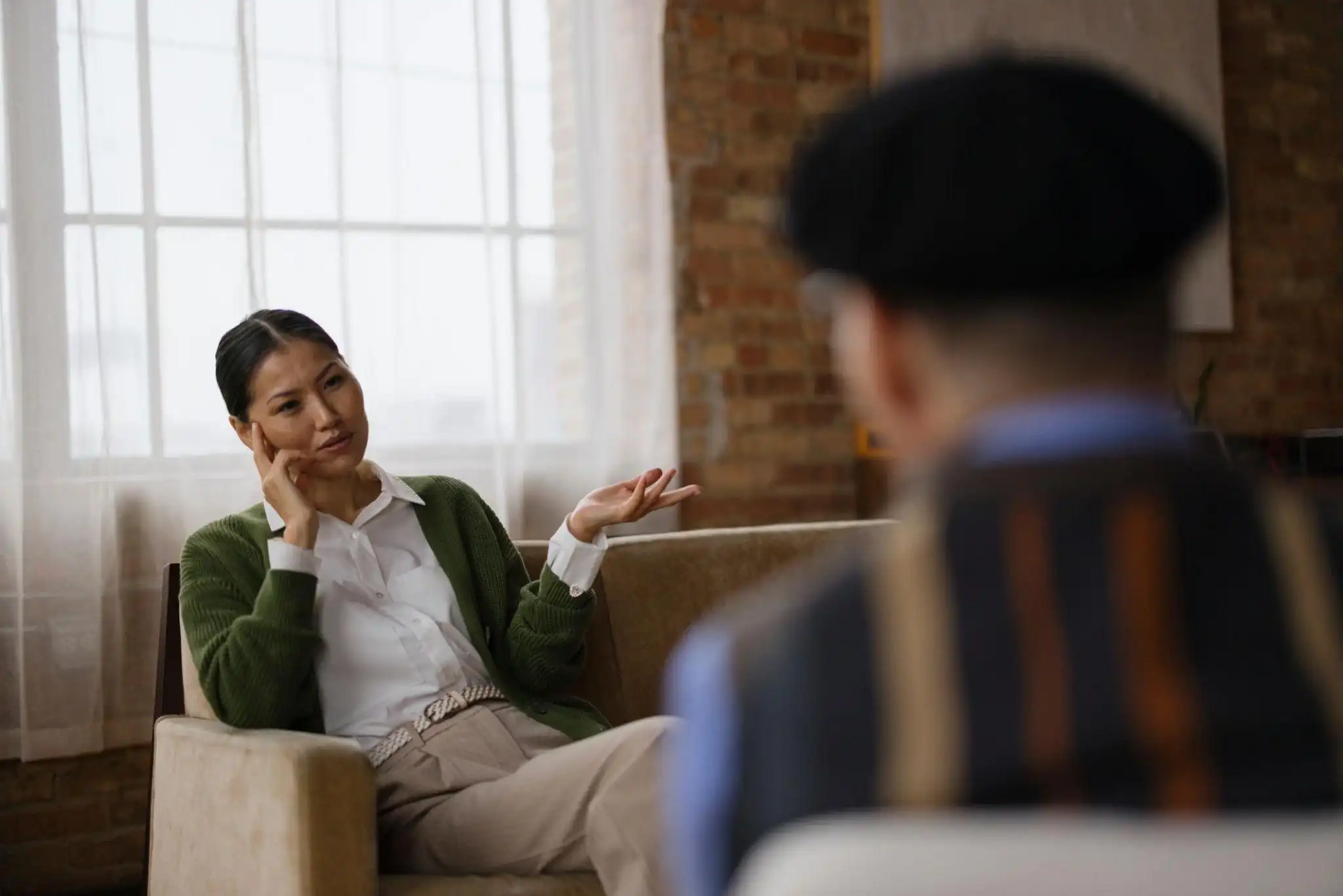 Client discussing concerns with a therapist during a counseling session